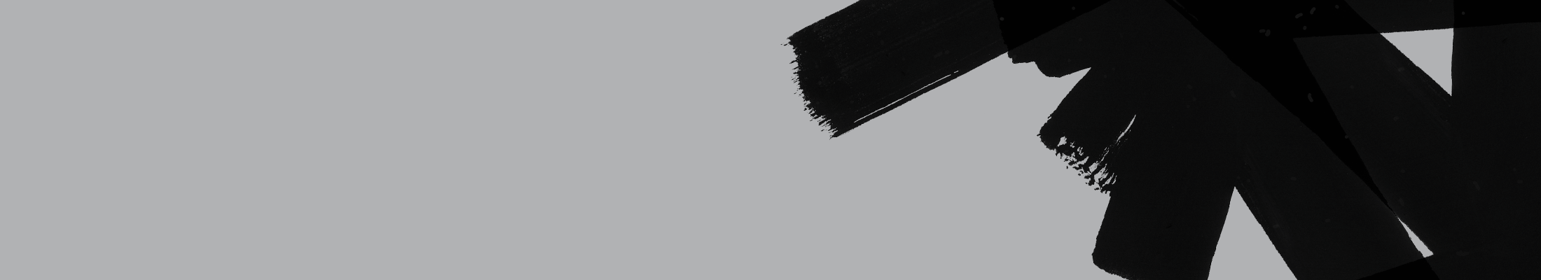 black brush strokes on grey background
