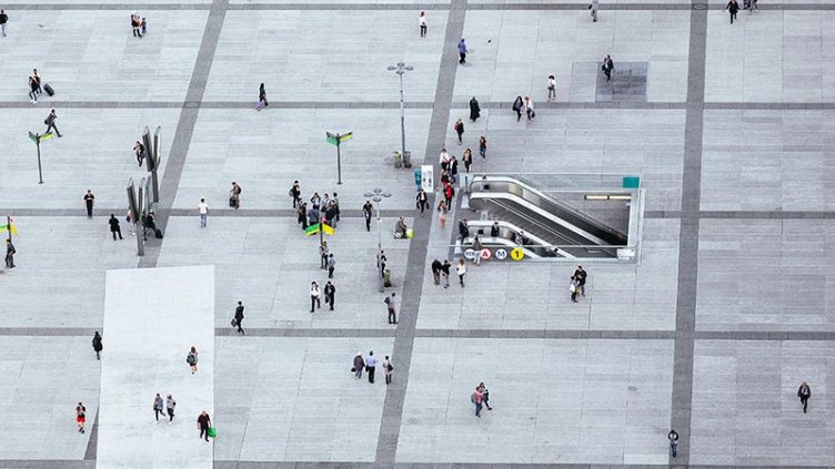 top view of people walk on the pedestrian concrete pavement going towards metro station