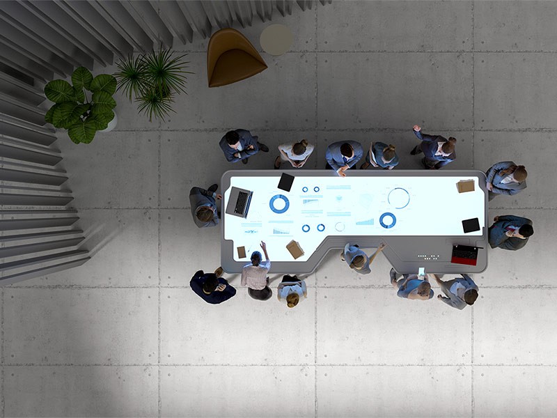 Group of business people with futuristic working desk