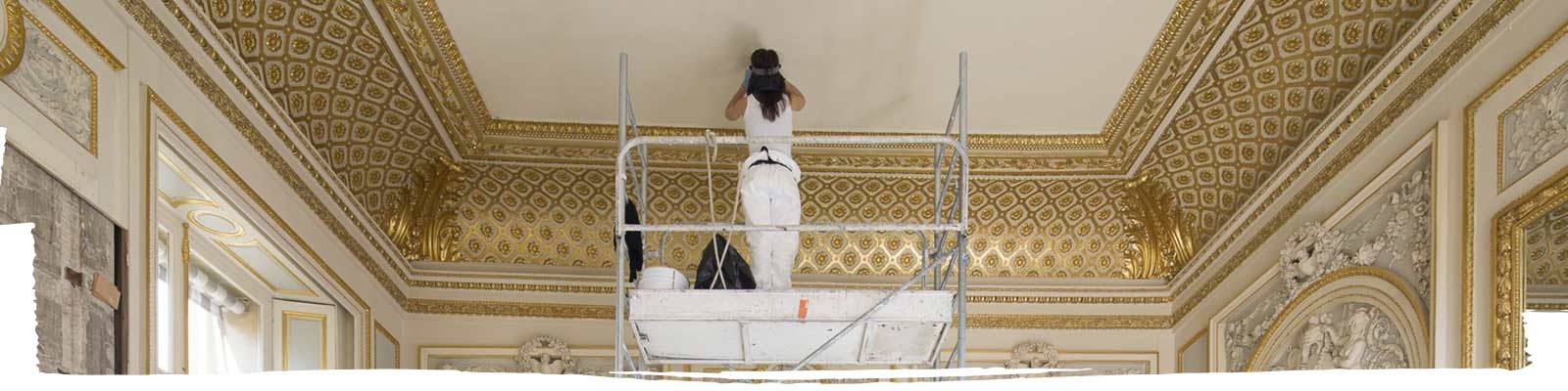 A person painting a roof