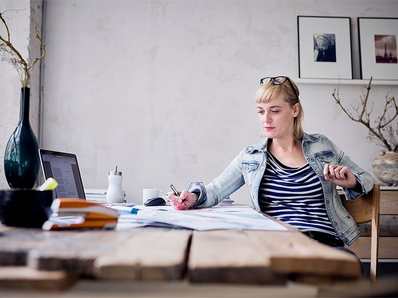 Women working on her project from home	