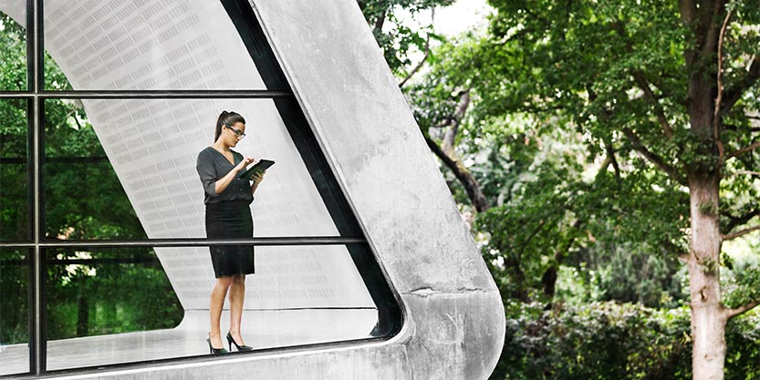 lady standing with a device in hand