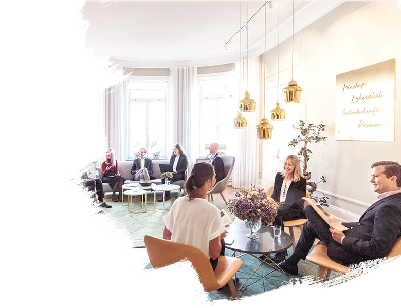 Three working professional having a discussion at a coworking area